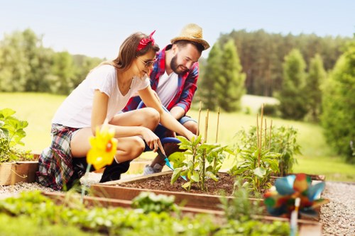 Landscape gardening in Southall with a well-designed patio and planting beds